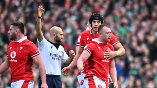 Tommy Reffell walking away after receiving a penalty.