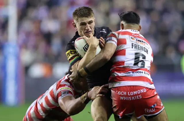 Jack Cole is tackled by Bevan French