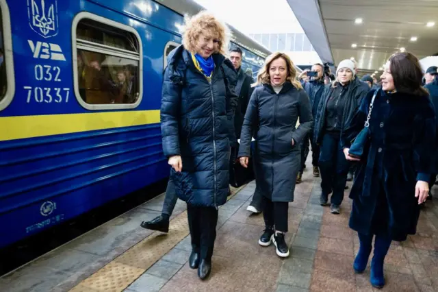 Italian Prime Minister Giorgia Meloni on the platform having arrived by train