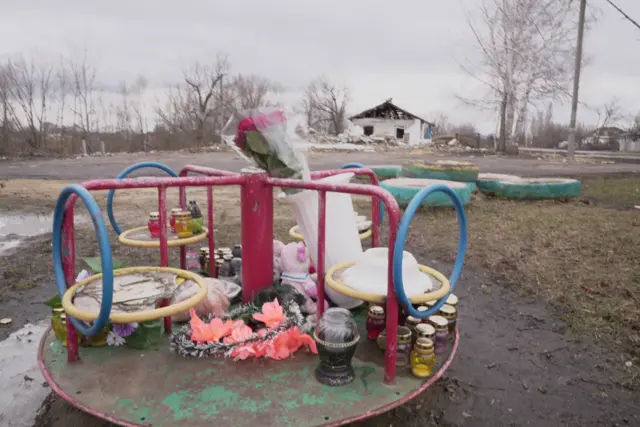 Flowers laid at a playground in Hroza