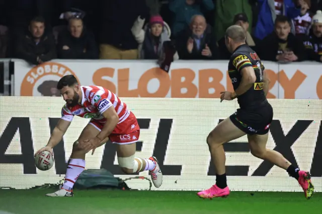 Abbas Miski scores Wigan's first try against Penrith