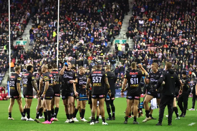 Penrith Panthers players warm up before the game