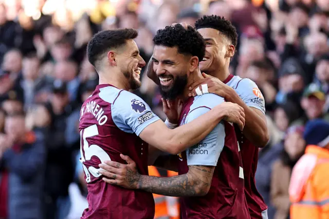 Douglas Luiz of Aston Villa celebrates