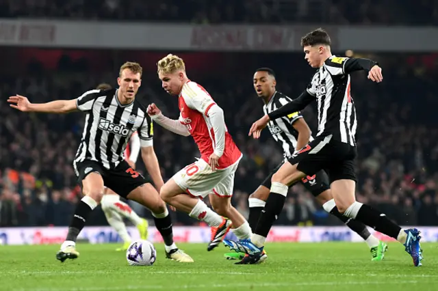 Emile Smith Rowe of Arsenal is challenged by Dan Burn and Lewis Miley