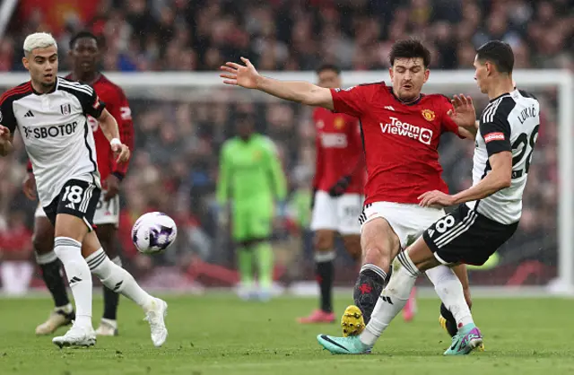 Harry Maguire tackles Fulham's Serbian midfielder Sasa Lukic