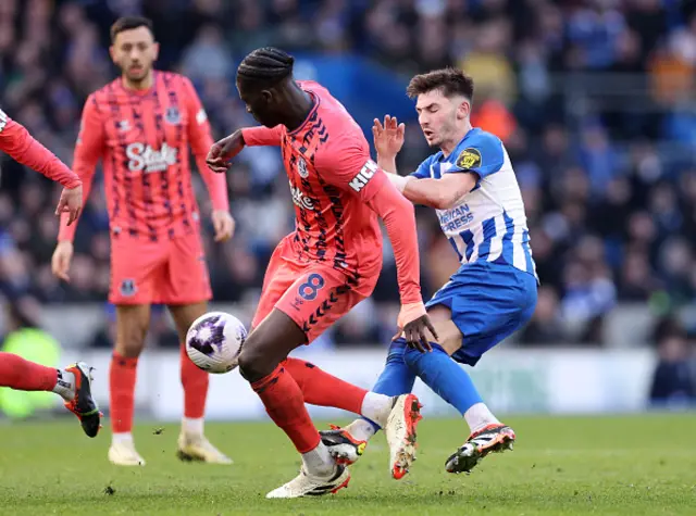 : Billy Gilmour of Brighton & Hove Albion fouls Amadou Onana