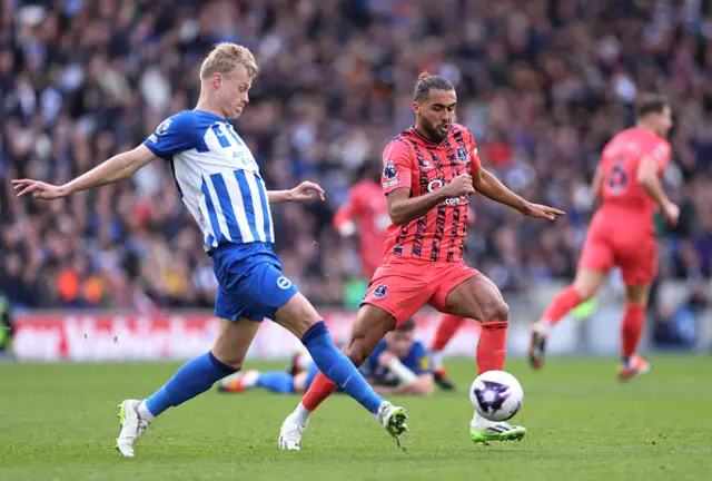 : Jan Paul van Hecke of Brighton & Hove Albion passes the ball whilst under pressure from Dominic Calvert-Lewin