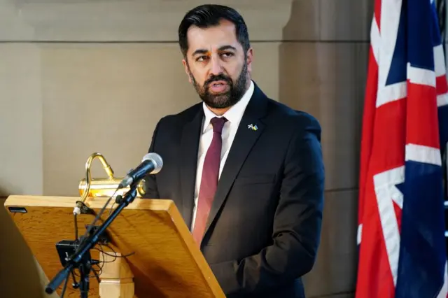 Humza Yousaf speaking at a service in Edinburgh