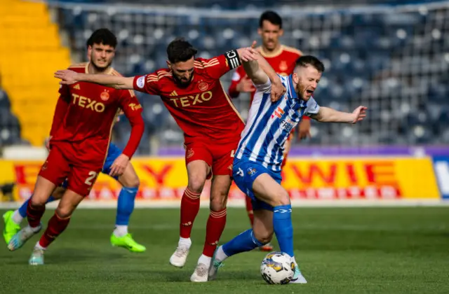 Aberdeen's Graeme Shinnie and Kilmarnock's Liam Polworth tussle for possession