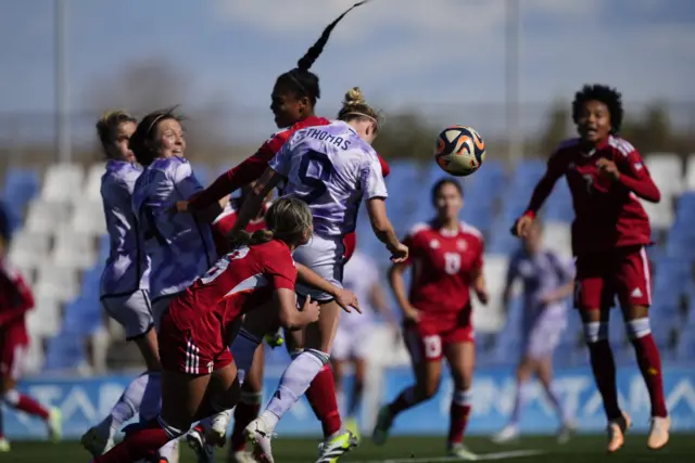 Martha Thomas heads in Scotland's second goal against the Philippines