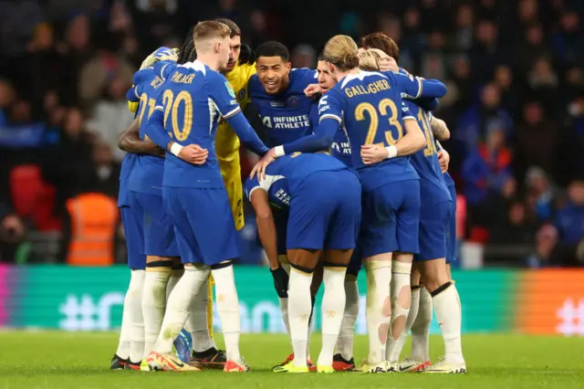 Chelsea players huddle prior to the start of extra-time during the Carabao Cup Final match between Chelsea and Liverpool