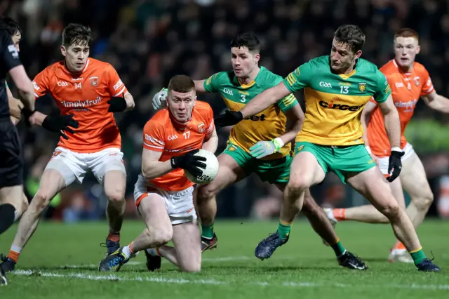 Donegal's Brendan McCole and Hugh McFadden are about to challenge Armagh's Ross McQuillan in last year's Division One game at the Athletic Grounds