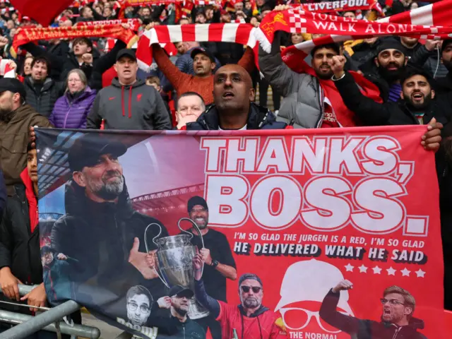 Liverpool fans show support of their manager Jurgen Klopp during the Carabao Cup Final match between Chelsea and Liverpool