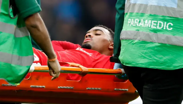 Ryan Gravenberch of Liverpool is injured and is carried off on a stretcher by paramedics during the Carabao Cup final