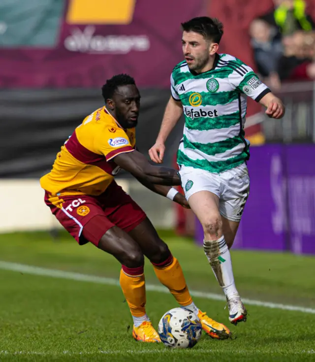 Motherwell's Bevis Mugabi and Celtic's Greg Taylor