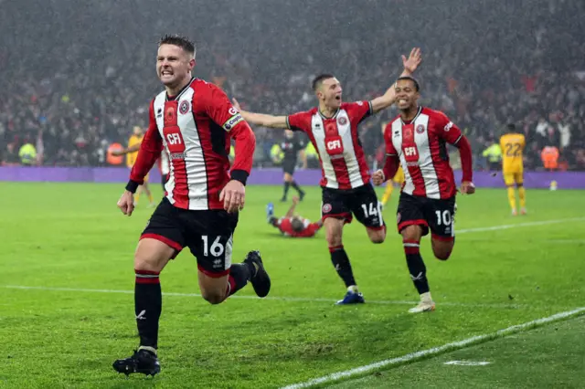 Oliver Norwood celebrates scoring against Wolves