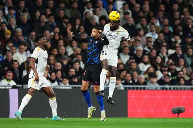 Antonio Ruediger competes for a header with Yousseff En-Nesyri