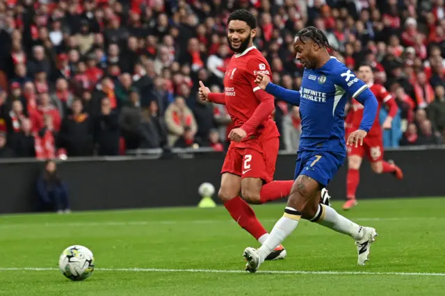 Chelsea midfielder Raheem Sterling (R) scores but the goal is disallowed due to offside, following a VAR review