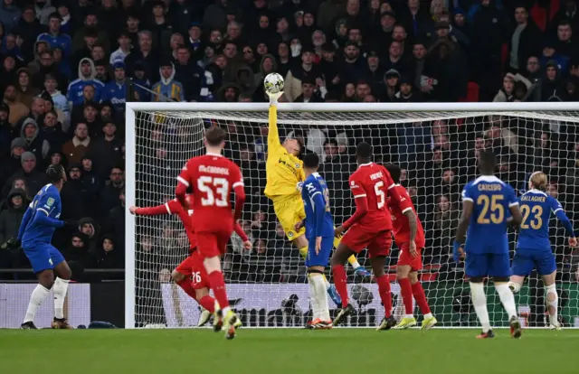 Djordje Petrovic saves a shot from Liverpool's English striker #76 Jayden Danns (unseen) during the English League Cup final football match between Chelsea and Liverpool