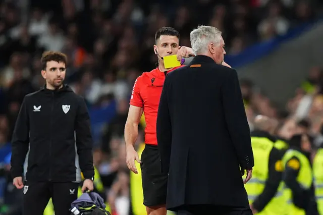 Carlo Ancelotti is shown a yellow card