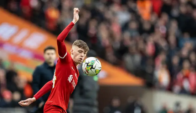 Conor Bradley of Liverpool in action against Chelsea