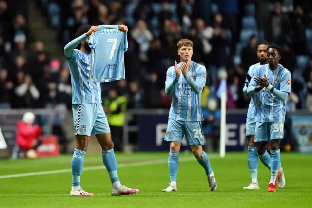 Ellis Simms holds up a Tatsuhiro Sakamoto shirt after scoring against Coventry