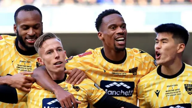 Maidstone United players celebrate