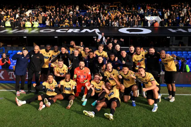 The Maidstone players celebrating after beating Ipswich