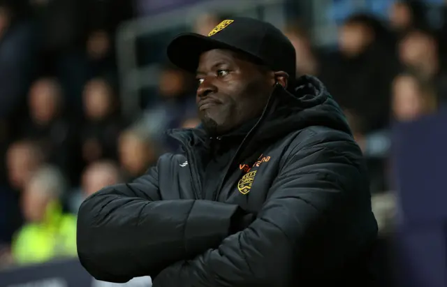 Maidstone boss George Elokobi watches on at Coventry