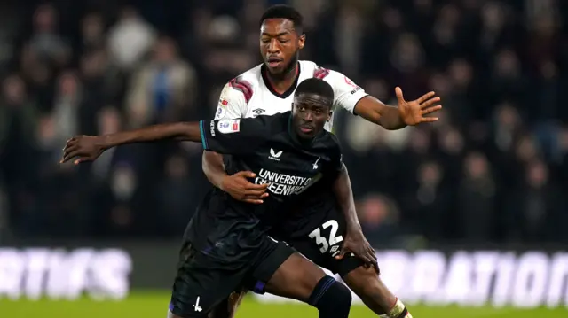 Charlton Athletic's Panutche Camara (front) and Derby County's Ebou Adams