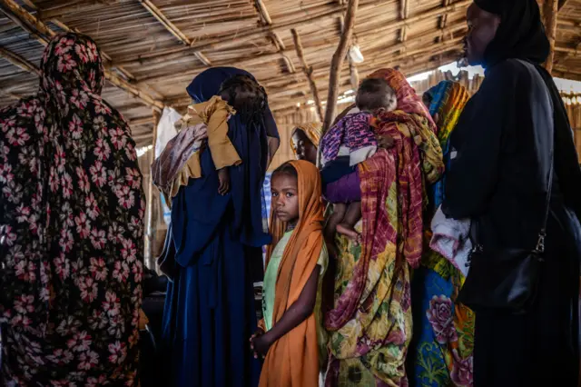 Sudanese people at a border camp.