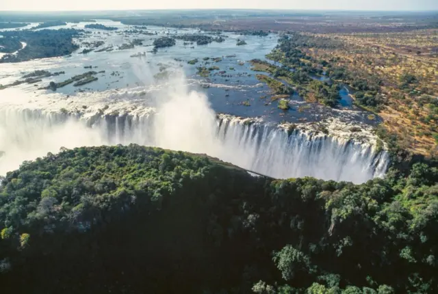 Aerial view of the Victoria Falls (Unesco World Heritage List, 1989) on the Zambezi River, Mosi-oa-Tunya National Park, Zambia, and Victoria Falls National Park, Zimbabwe.