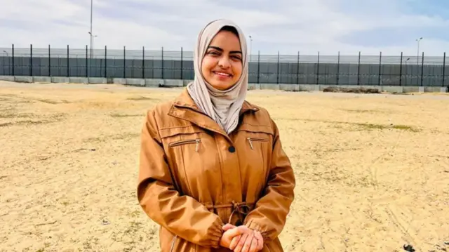 Dr Haya Hijazi on sandy beach in Gaza