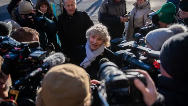 Jo Hamilton surrounded by photographers