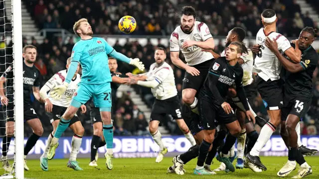 Derby County's Eiran Cashin (centre) scores against Charlton Athletic