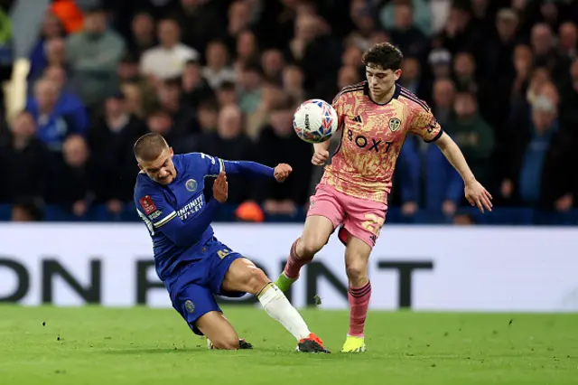 Daniel James of Leeds United is challenged by Alfie Gilchrist