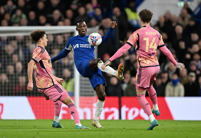 Nicolas Jackson of Chelsea battles for possession with Ethan Ampadu and Joe Rodon