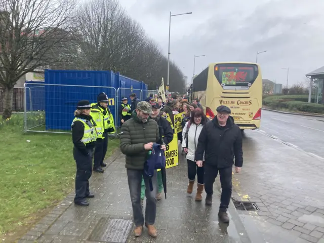 Protesters walking to the Senedd