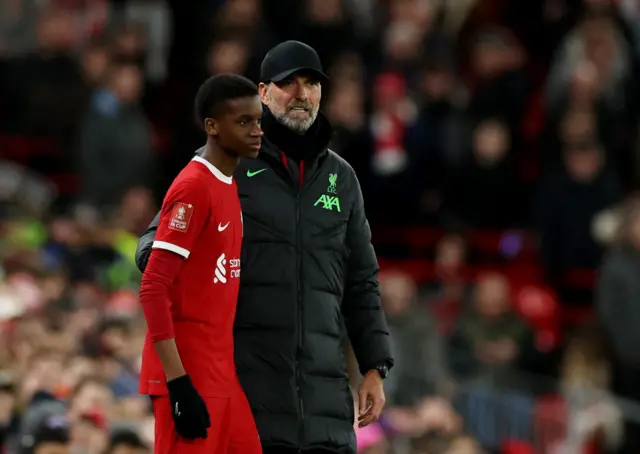 Trey Nyoni with manager Juergen Klopp before he comes on as a substitute