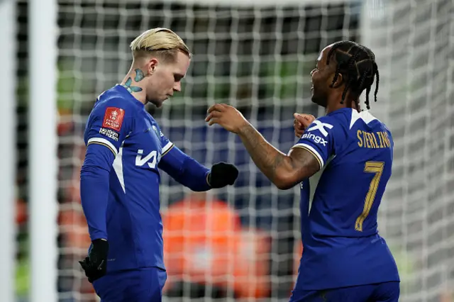 Mykhaylo Mudryk of Chelsea celebrates with Raheem Sterling