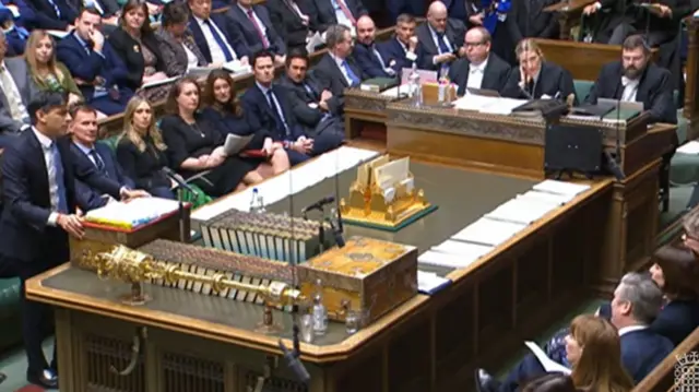 Sunak stands at the despatch box in the House of Commons