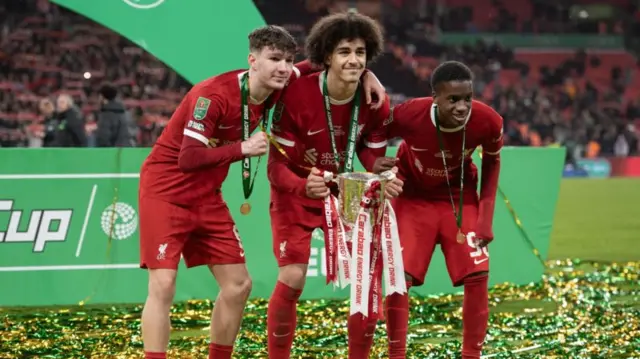 Liverpool players lift the Carabao Cup trophy