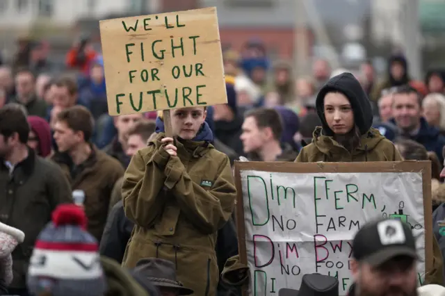 Protesters holding placards gather outside the Senedd on February 28, 2024 in Cardiff, Wales