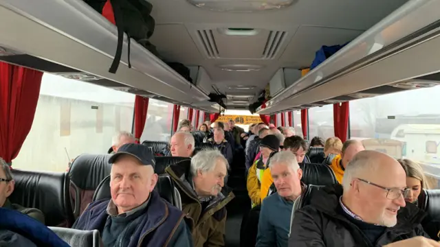 Group of farmers in bus