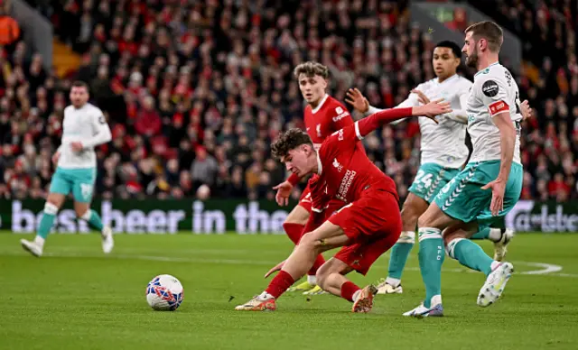 ) Lewis Koumas of Liverpool competing with Jack Stephens of Southampton