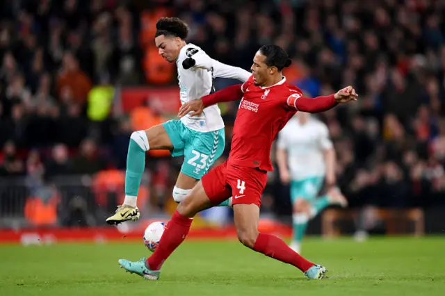 Samuel Edozie of Southampton is challenged by Virgil van Dijk