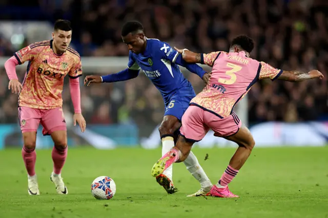 Nicolas Jackson of Chelsea battles for possession with Joel Piroe and Junior Firpo