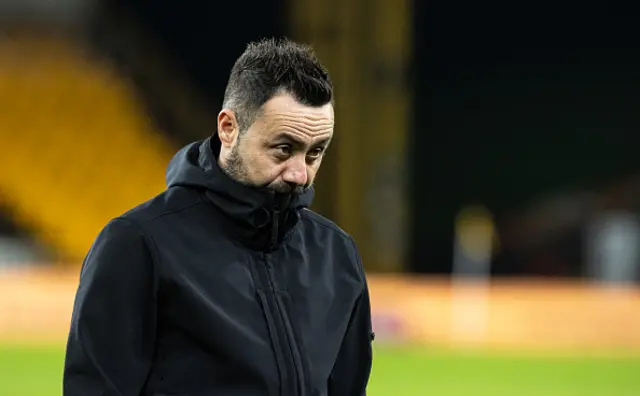 Brighton & Hove Albion's manager Roberto De Zerbi looks on