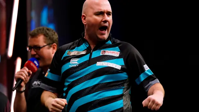 Rob Cross celebrates