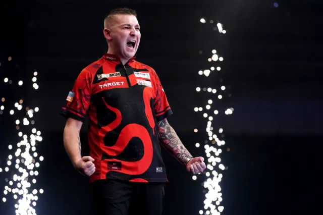 Nathan Aspinall celebrates during night five of the Premier League Darts in Exeter